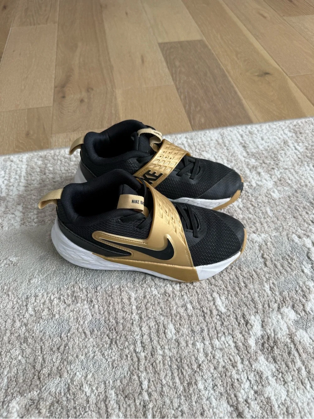 EUC Nike Kids Black and Gold Basketball Shoes